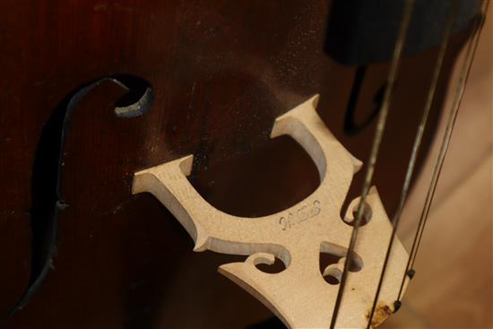 A cased cello with bow